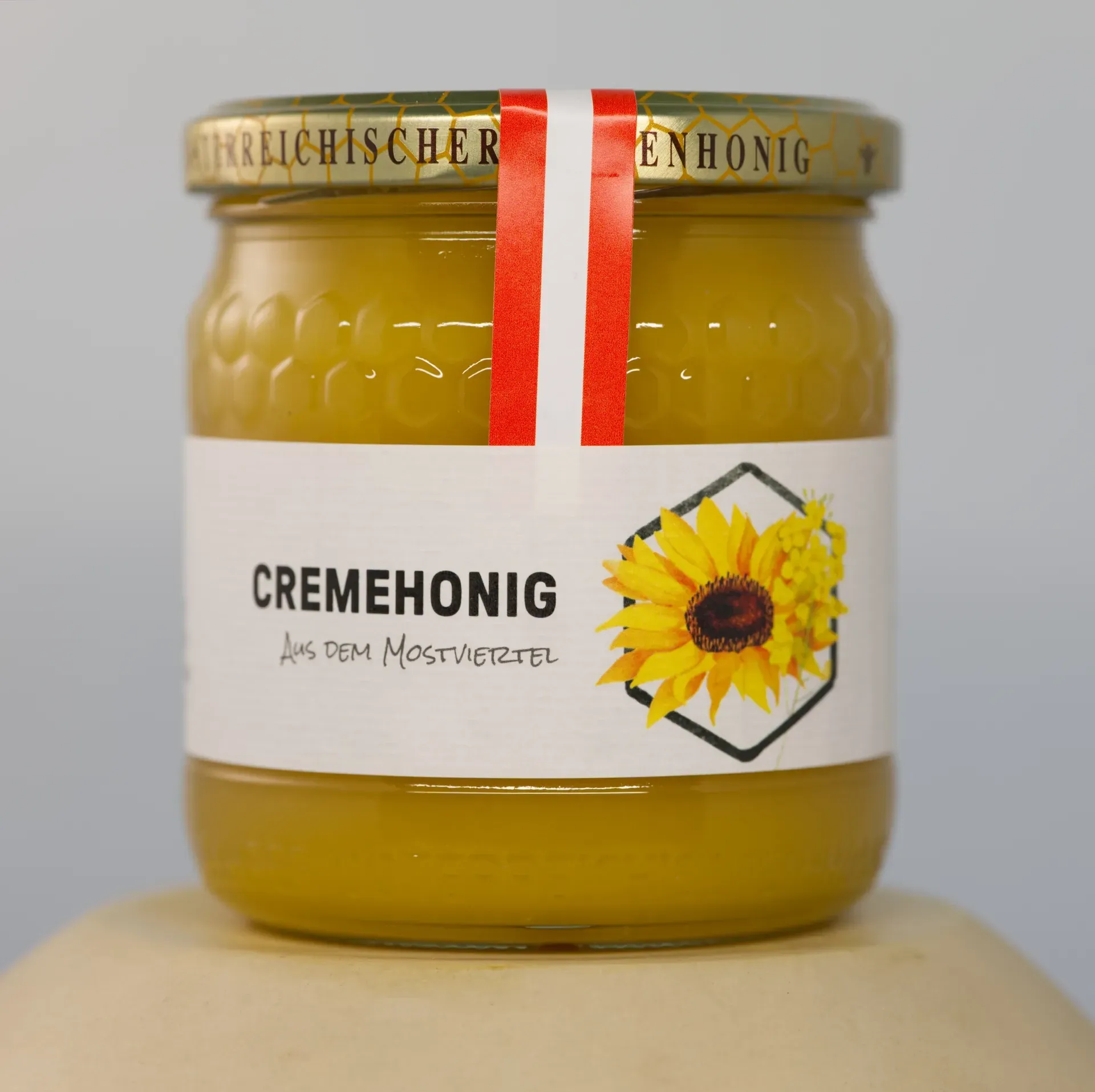 Jar of smooth, creamy honey with a spreadable texture