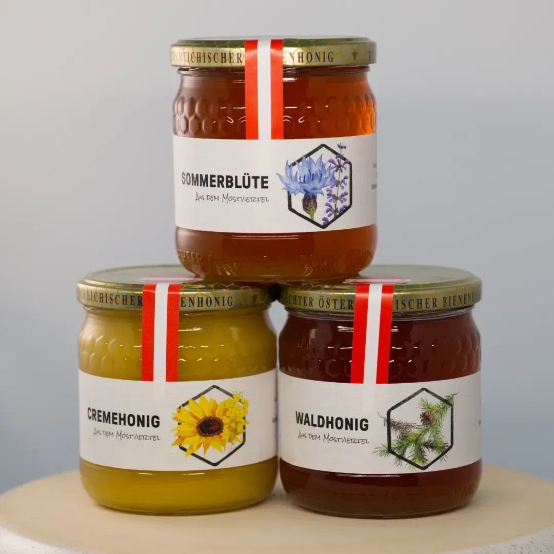 One jar each of forest honey, summer blossom honey, and creamed honey